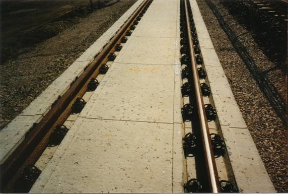 Ballastless track with discrete rail seats on continuously reinforced concrete pavement